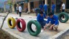 Đoàn viên thanh niên lắp đặt đồ chơi vận động ngoài trời cho các em học sinh trường Mầm non- Tiểu học thôn Nậm Phảng - xã Gia Phú